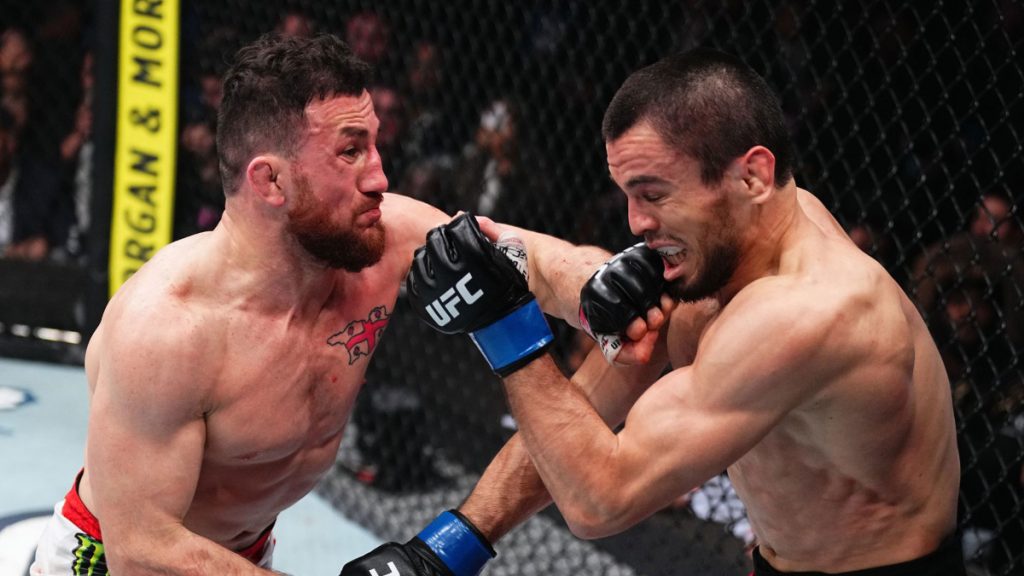 Merab Dvalishvili punches Umar Nurmagomedov